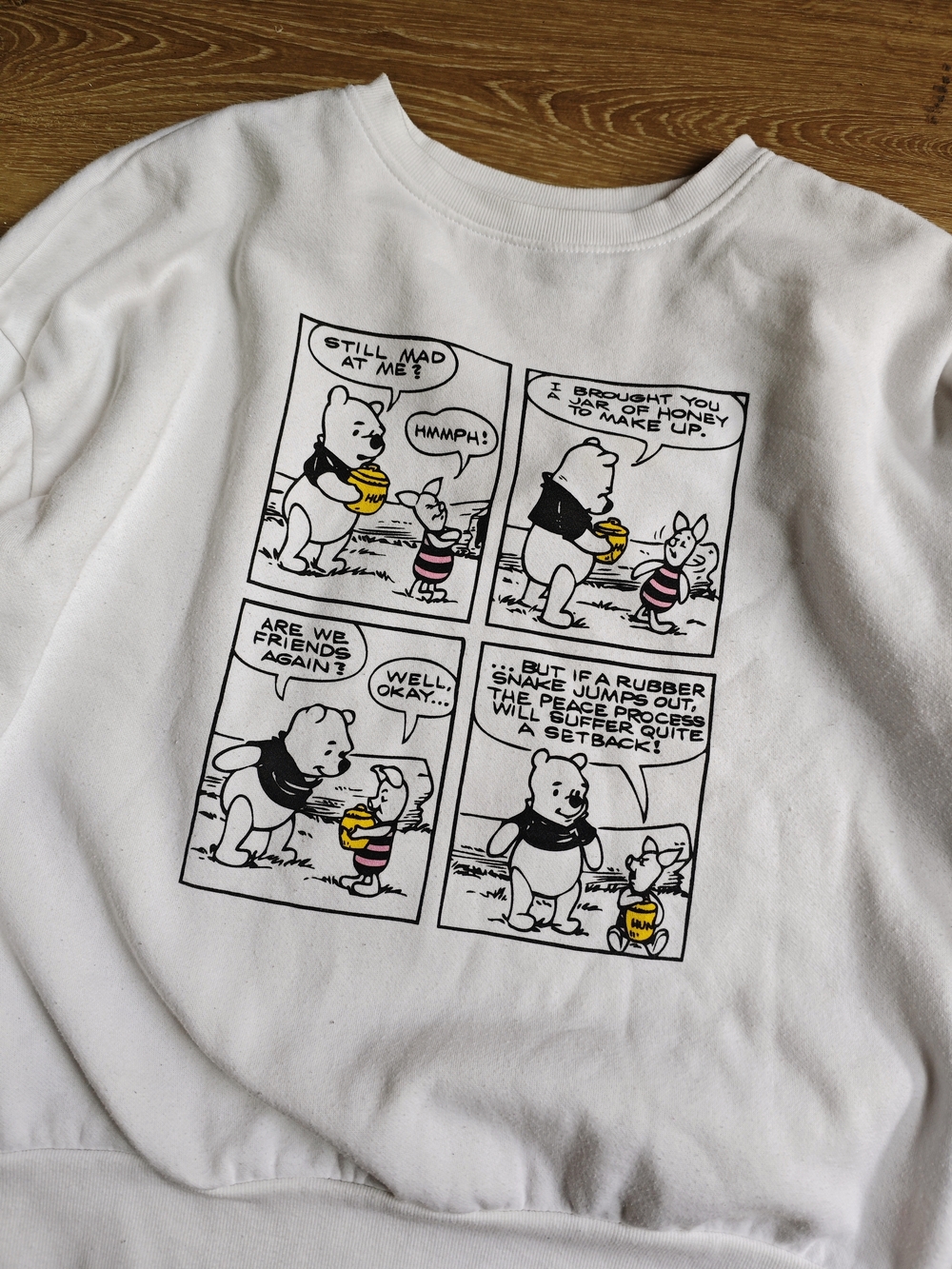Disney Winne-The-Pooh White Sweatshirt with Black Logo and Red Nail Accent